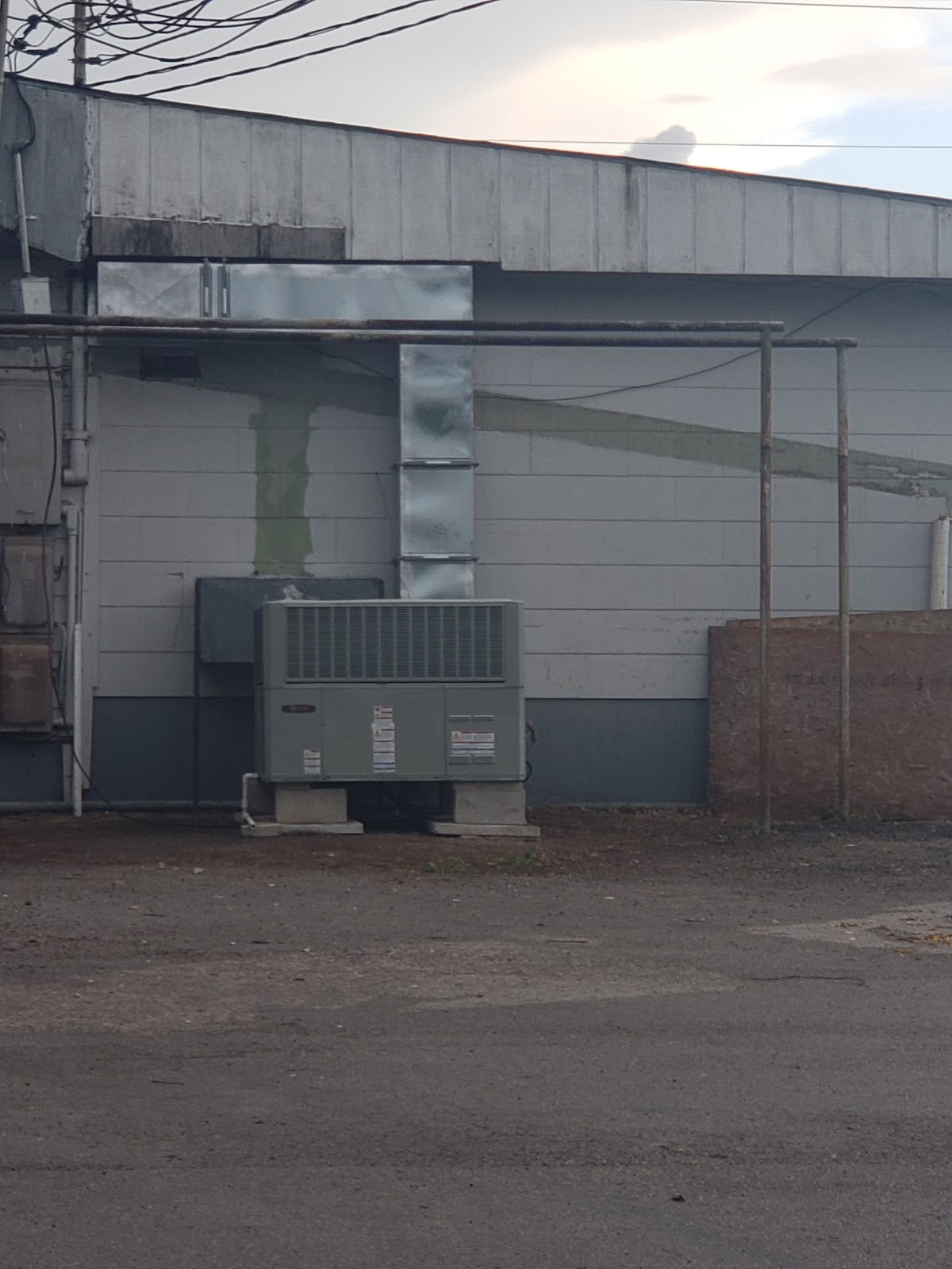 Rooftop commercial packaged HVAC unit on an industrial building